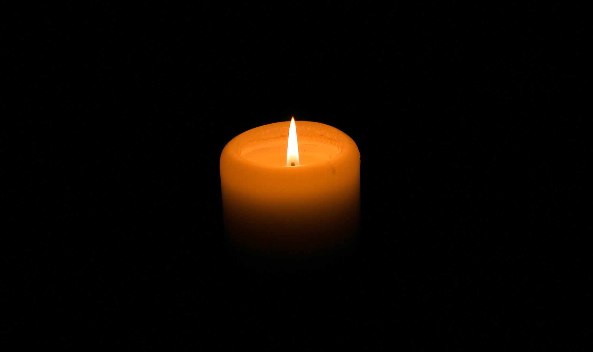 Candle on the black background, memorial remembrance day, no war, praying for peace